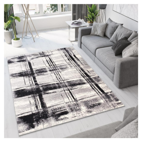 Vzorovaný koberec v bílé barvě