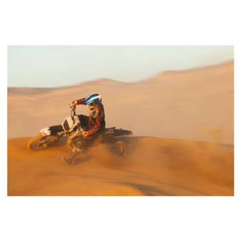 Fotografie Man motocross riding in desert terrain, John P Kelly, 40 × 26.7 cm