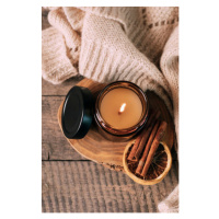 Fotografie Candle in small amber glass jar with wooden wick on wooden stand on background. Top v