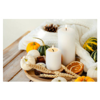 Fotografie Pumpkins and candle on a wooden table, Artsyslik, (40 x 26.7 cm)