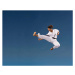 Fotografie Teenage boy  kicking in mid-air,, Siri Stafford, 40 × 30 cm