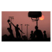 Fotografie Young men playing basketball at sunset., Grant Faint, 40x24.6 cm