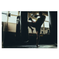 Fotografie Man kick boxer training alone in gym, South_agency, 40 × 26.7 cm