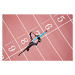 Fotografie Runner crossing finishing line on track, Paul Bradbury, 40 × 26.7 cm