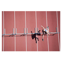 Fotografie Runner jumping hurdles on track, Paul Bradbury, 40 × 26.7 cm