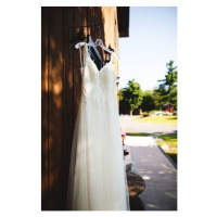 Fotografie Beautiful white wedding dress hanging elegantly, Wirestock, 26.7 × 40 cm