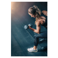 Fotografie Female Athlete Exercising with Dumbbells in, microgen, 26.7 × 40 cm