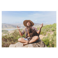 Fotografie young man meditating in nature with his dog., Rawlstock, 40 × 26.7 cm