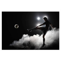 Fotografie Soccer player kicking the ball at night on stadium, Stanislaw Pytel, (40 x 26.7 cm)