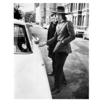 Fotografie Jagger, singer with the Rolling Stones, about to get into his car, c.1970, 30 × 40 cm