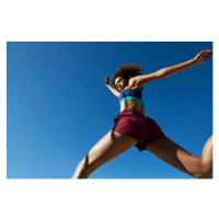 Fotografie Young woman exercising against clear sky, Klaus Vedfelt, 40x26.7 cm