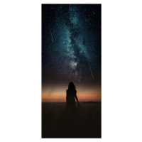 Umělecká fotografie Dramatic and fantasy scene with young woman looking universe with falling st