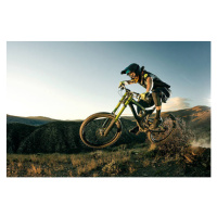 Fotografie Female biker jumping on her mountain bike., Daniel Milchev, 40 × 26.7 cm