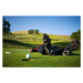 Fotografie Golfer lying on green, ball on edge of hole, Joe McBride, (40 x 26.7 cm)