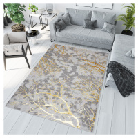 Jednoduchý moderní koberec v šedé barvě se zlatým motivem