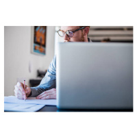 Fotografie Businessman writing notes at laptop desk, Portra Images, 40 × 26.7 cm