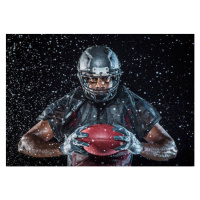 Umělecká fotografie Water splashing on Black football player, Erik Isakson, (40 x 30 cm)