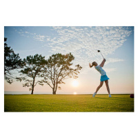 Fotografie Teen girl makes a powerful drive on a golf course, Stephen Simpson, 40x26.7 cm
