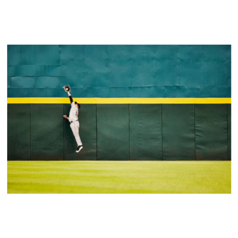 Fotografie Wide shot baseball player jumping for, Thomas Barwick, 40 × 26.7 cm