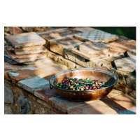 Fotografie Olive fruits in container kept on paving stones, andersdahl65, 40 × 26.7 cm