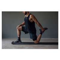 Fotografie Muscular Sportsman Stretching his Legs to, FreshSplash, (40 x 26.7 cm)
