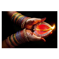 Fotografie Woman with lit earthen lamp at Diwali festival, Subir Basak, 40 × 26.7 cm