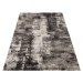 Brilatní béžově hnědý koberec s jemným abstraktním motivem
