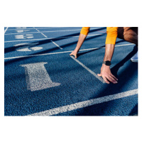 Fotografie Sportsman at starting line of running track, Westend61, 40 × 26.7 cm