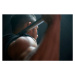 Fotografie Male athlete lifting weight bar black background, Tara Moore, 40 × 26.7 cm