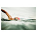 Fotografie Woman taking a breath during open water swim, Thomas Barwick, 40x26.7 cm