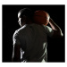 Fotografie man holding basketball on shoulder, Tara Moore, 40x35 cm