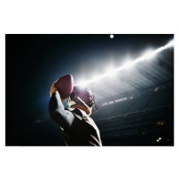 Umělecká fotografie Quarterback preparing to throw pass at night, Thomas Barwick, (40 x 26.7 cm)