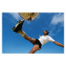 Fotografie Soccer player kicking ball, low angle, David Madison, 40 × 26.7 cm