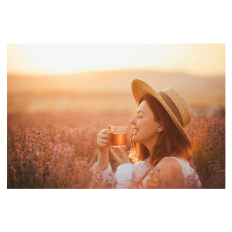 Fotografie Young happy woman drinking herbal tea,, Polina Lebed, 40 × 26.7 cm