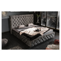 Estila Luxusní čalouněná postel Kreon s Chesterfield prošíváním šedá
