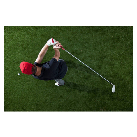 Fotografie A golfer swinging a golf club, overhead view, fStop Images - Halfdark, 40 × 26.7 cm