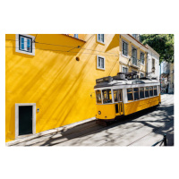 Fotografie Yellow tram moving past yellow building, Alexander Spatari, 40 × 26.7 cm