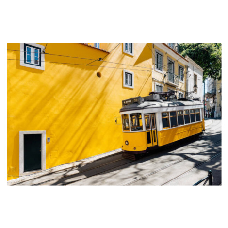 Fotografie Yellow tram moving past yellow building, Alexander Spatari, 40 × 26.7 cm