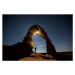 Umělecká fotografie A hiker standing underneath an arch., Jordan Siemens, (40 x 26.7 cm)